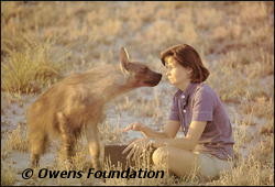 Delia Owens greets the brown hyena Pepper.